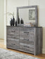 Bronyan King Panel Bed with Mirrored Dresser and Chest